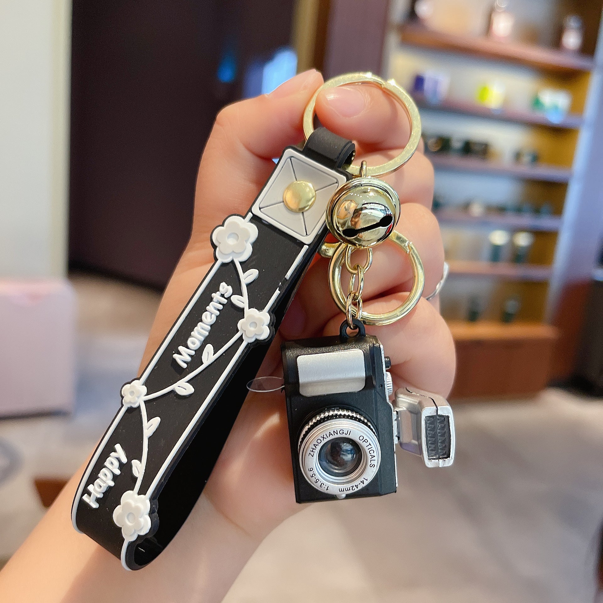 Wholesale Acrylic LED Lighting and Sounding Daisy Simulation Small Camera Keychain